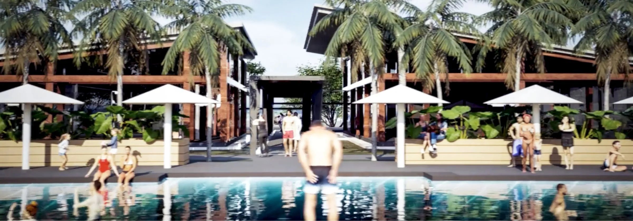 People enjoying a pool surrounded by tropical plants and modern buildings.