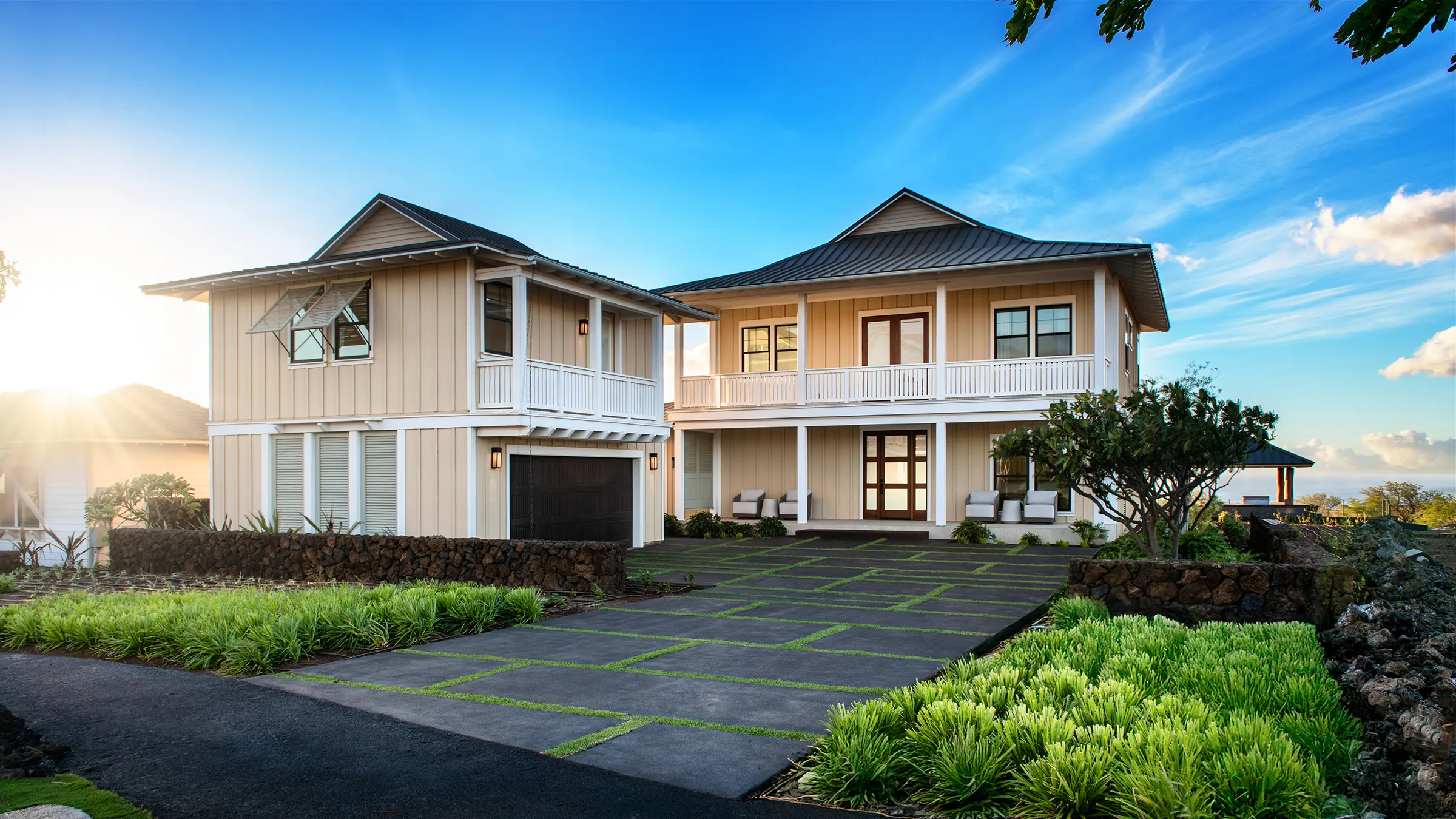 Single-story house with pool, surrounded by greenery under a clear blue sky.