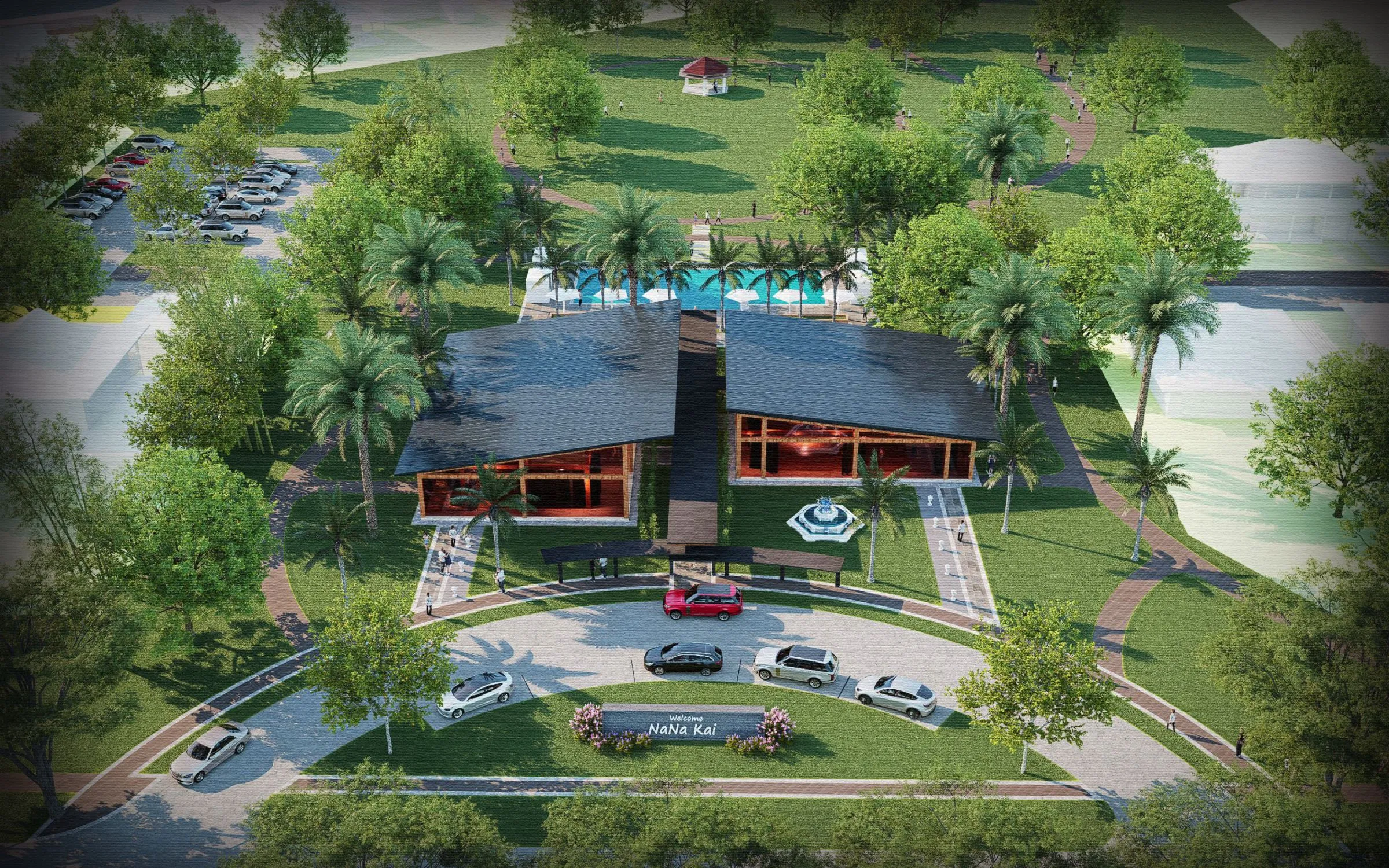 Aerial view of a modern building surrounded by trees and parked cars.