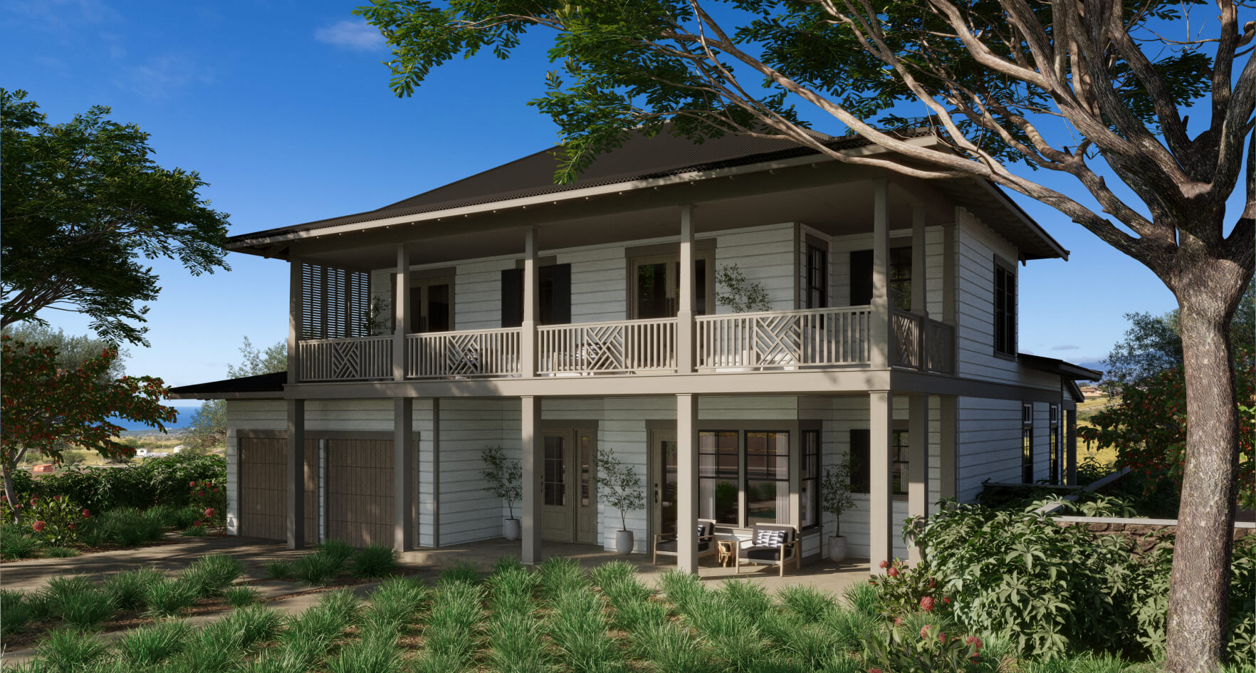 A two-story house with a wraparound porch, nestled among lush greenery and trees on the Big Island, sits beneath a clear blue sky.