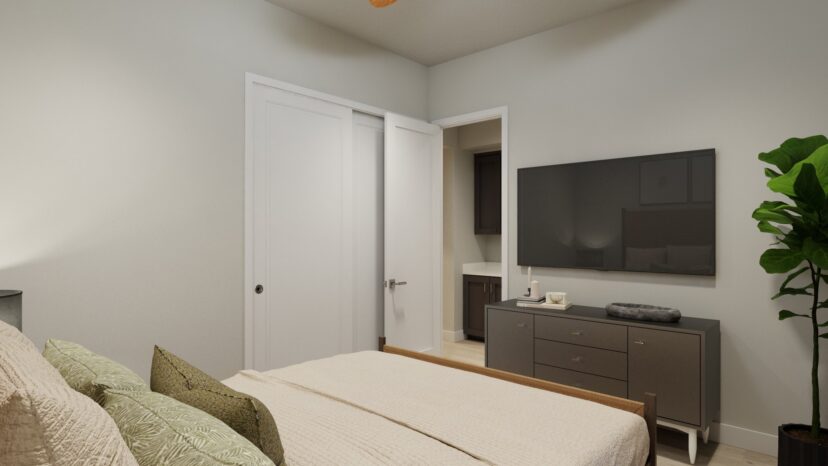 A modern bedroom featuring a bed with neutral bedding, a dresser with a large TV above it, a potted plant, and a partially open closet door.