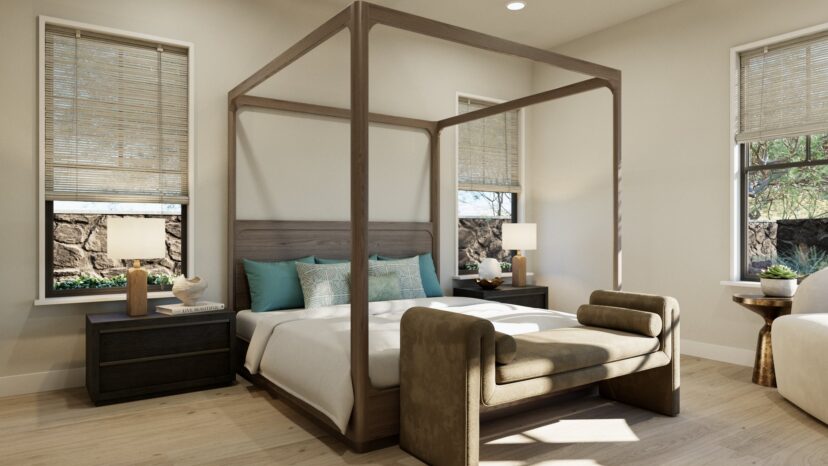 A bedroom with a four-poster bed, teal pillows, two nightstands, lamps, and a bench at the foot. Two windows with bamboo shades are on either side.