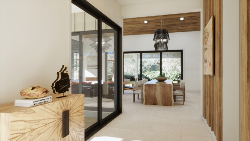 Modern dining area with a wooden table and chairs, glass pendant lights, large windows, and art on the walls. A wooden cabinet with decor and a book is in the foreground.