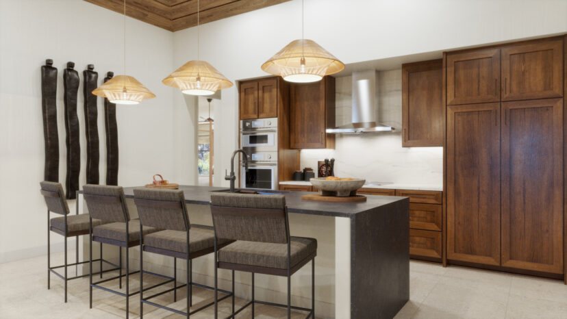 A kitchen with a large island, four cushioned bar stools, pendant lights, wooden cabinets, a built-in oven, and stainless steel hood.