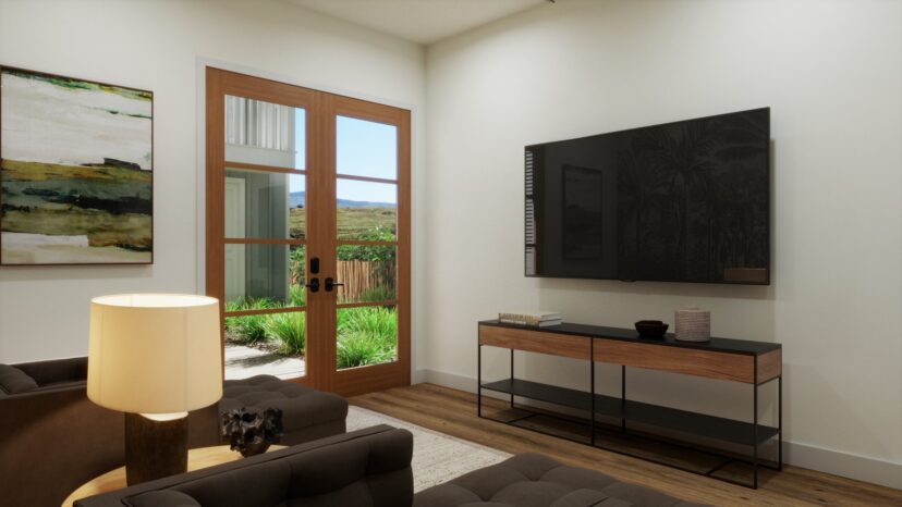 Modern living room with a wall-mounted TV, a wooden console, two chairs, a lamp, and a door leading to a garden view.