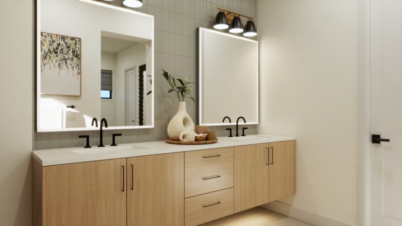 Modern bathroom with dual sinks, wooden cabinets, large mirrors with backlighting, and a decorative vase. Three overhead lights illuminate the area.