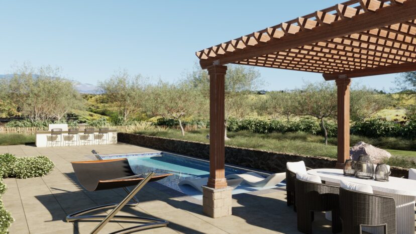 Outdoor patio with a pool, wooden pergola, dining table, and chairs in the foreground. Lounge chairs and a bar area are visible, with trees and shrubs in the background. Clear sky overhead.