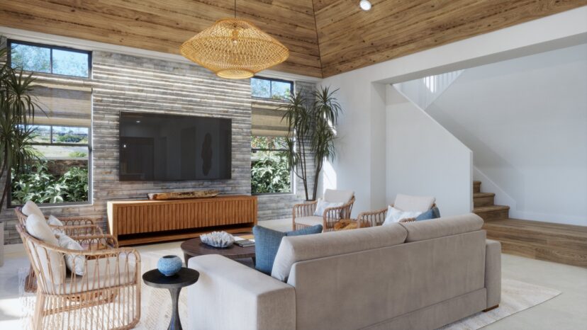 A modern living room with a beige sofa, wicker chairs, a large TV, wooden accents, indoor plants, and natural light from large windows. A staircase is visible on the right.