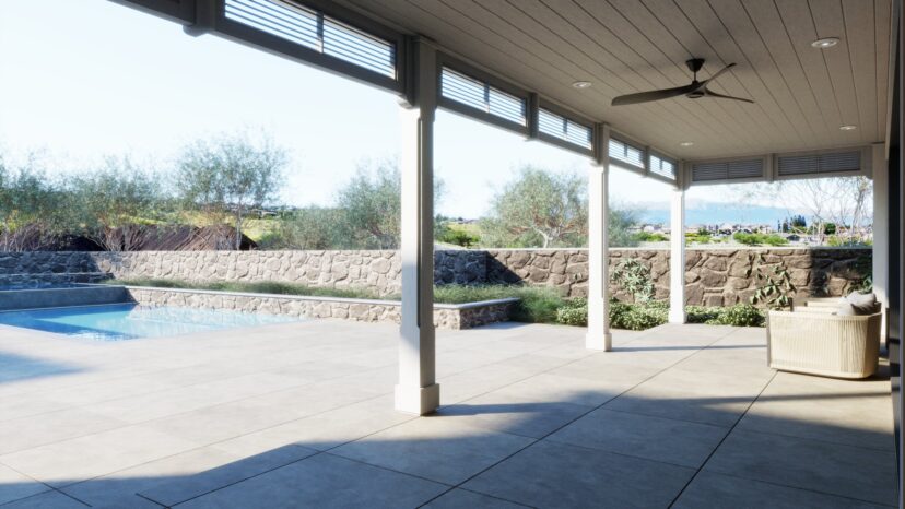 Covered patio with a ceiling fan overlooks a stone-walled pool area and garden, with distant hills visible in the background.