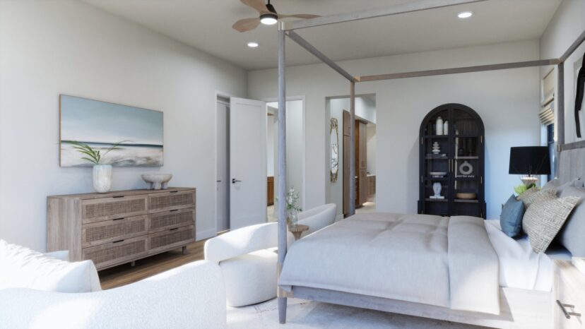 A modern bedroom with a four-poster bed, light wood dresser, ceiling fan, two chairs, and a tall cabinet. Neutral tones and coastal artwork adorn the room.